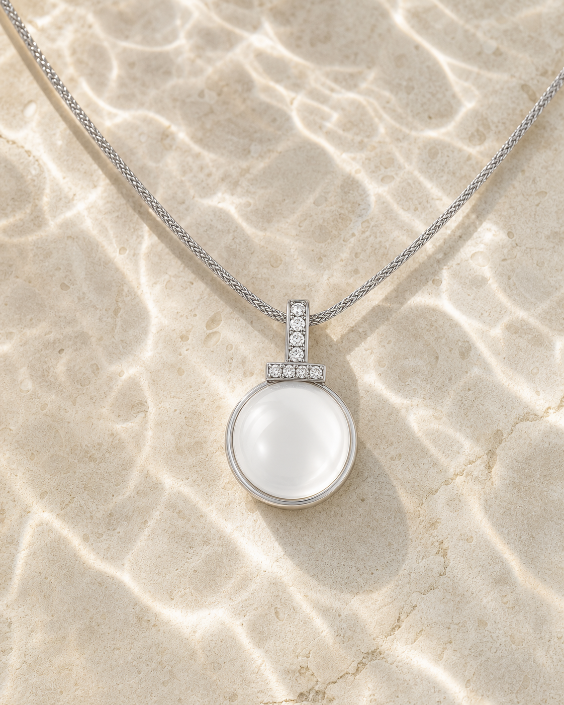Clear quartz interchangeable pendant necklace in water-reflection light