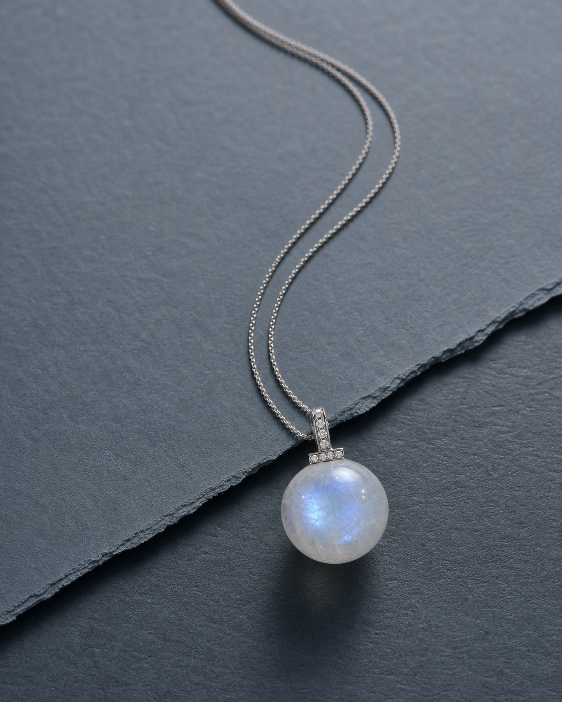 Blue Moonstone interchangeable pendant necklace, crystal still-life detail