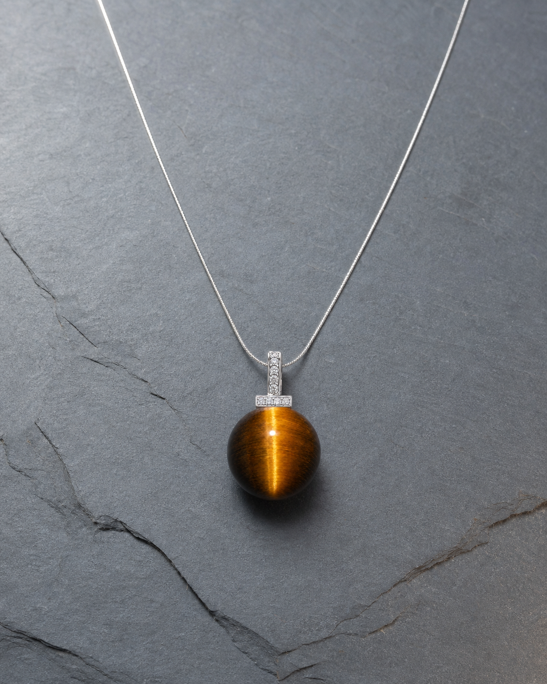 Yellow Tiger’s Eye interchangeable pendant necklace, crystal still-life detail