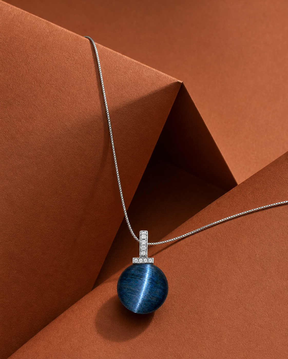 Blue Tiger’s Eye interchangeable pendant necklace, crystal still-life detail