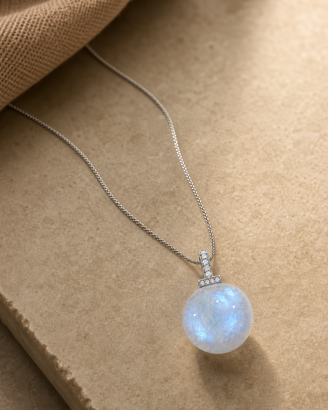 Blue Moonstone interchangeable pendant necklace, crystal still-life detail