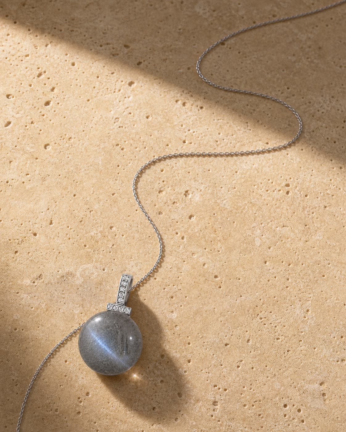 Gray Moonstone interchangeable pendant necklace, crystal still-life detail