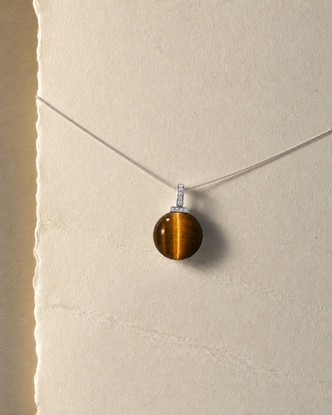 Yellow Tiger’s Eye interchangeable pendant necklace, crystal still-life detail