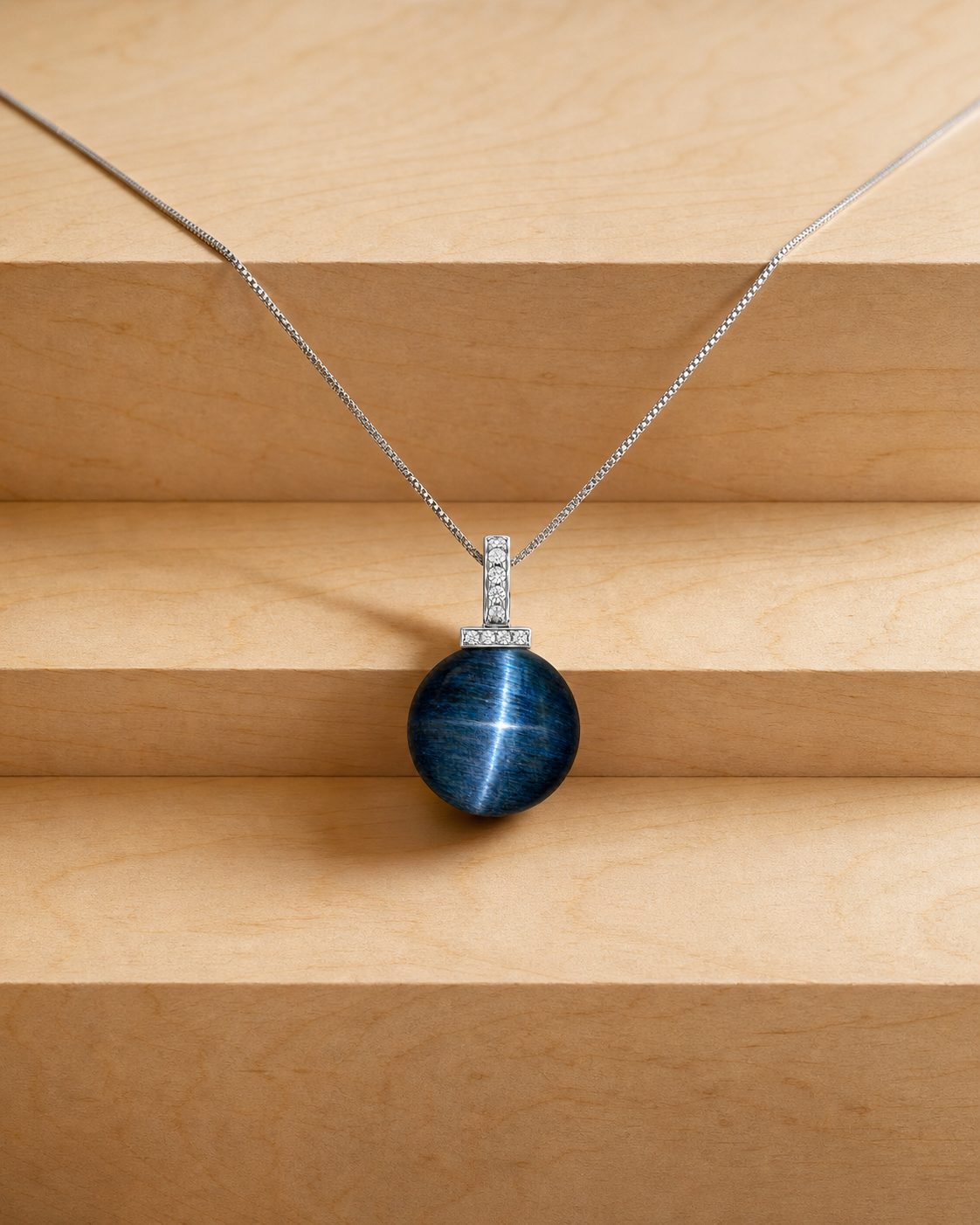 Blue Tiger’s Eye interchangeable pendant necklace, crystal still-life detail
