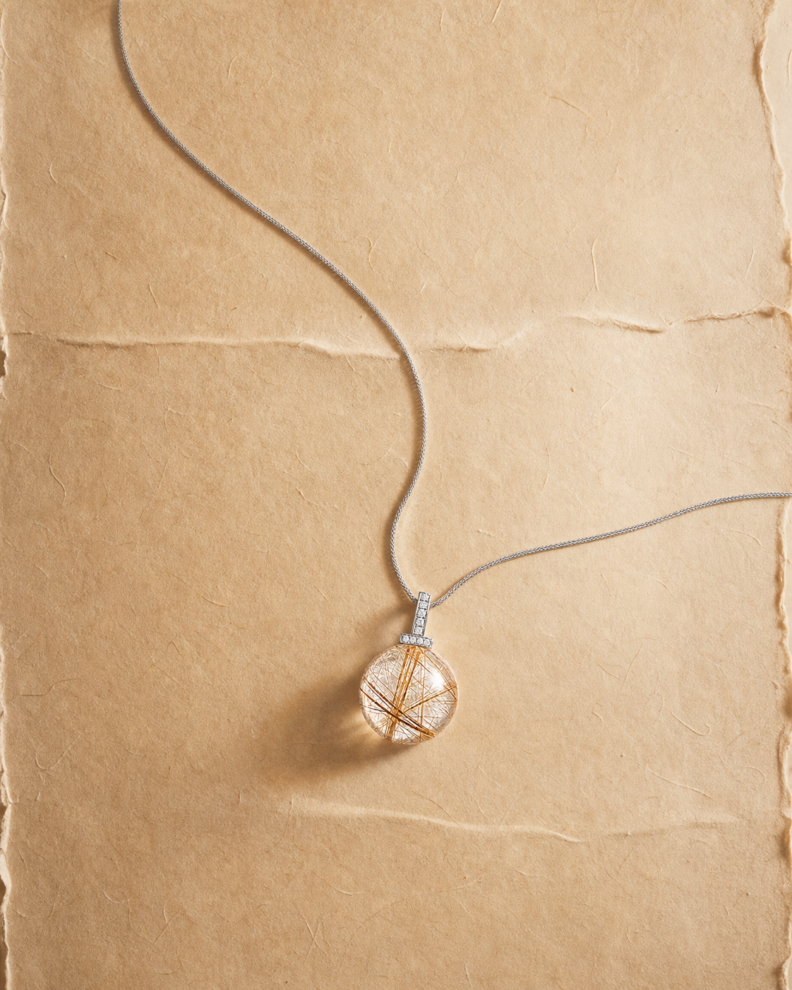 Golden Rutilated Quartz interchangeable pendant necklace, crystal still-life detail