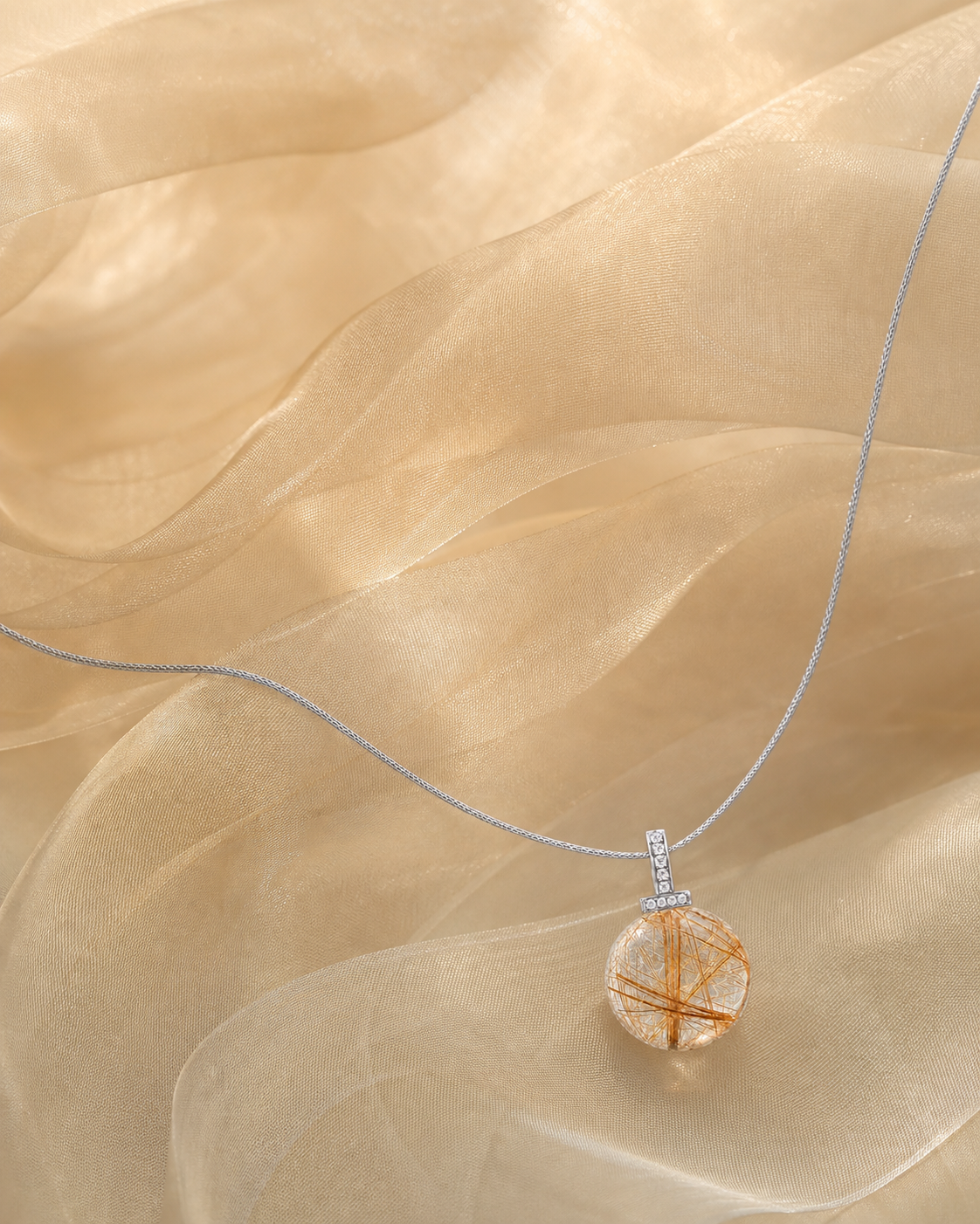 Golden Rutilated Quartz interchangeable pendant necklace, crystal still-life detail