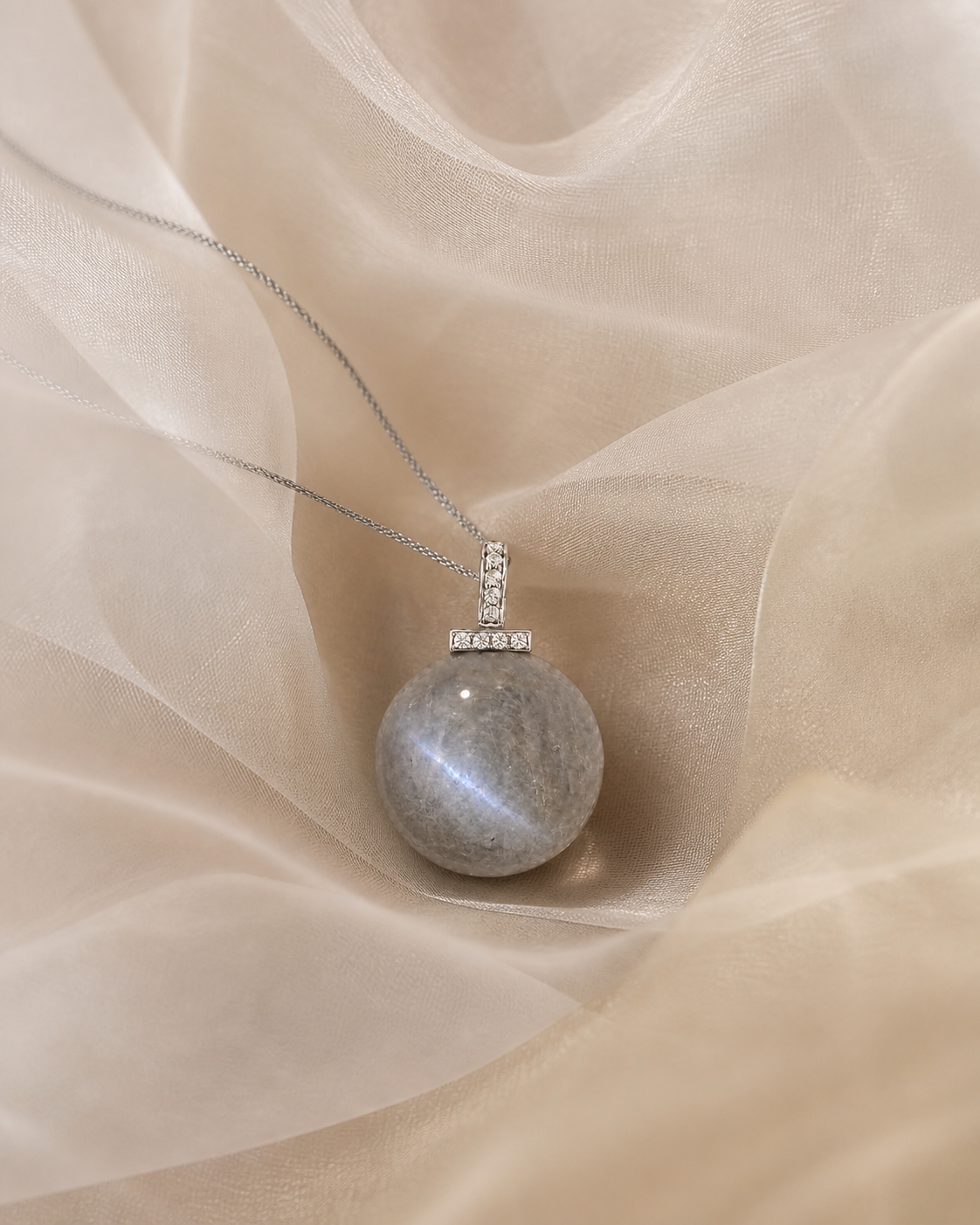 Gray Moonstone interchangeable pendant necklace, crystal still-life detail