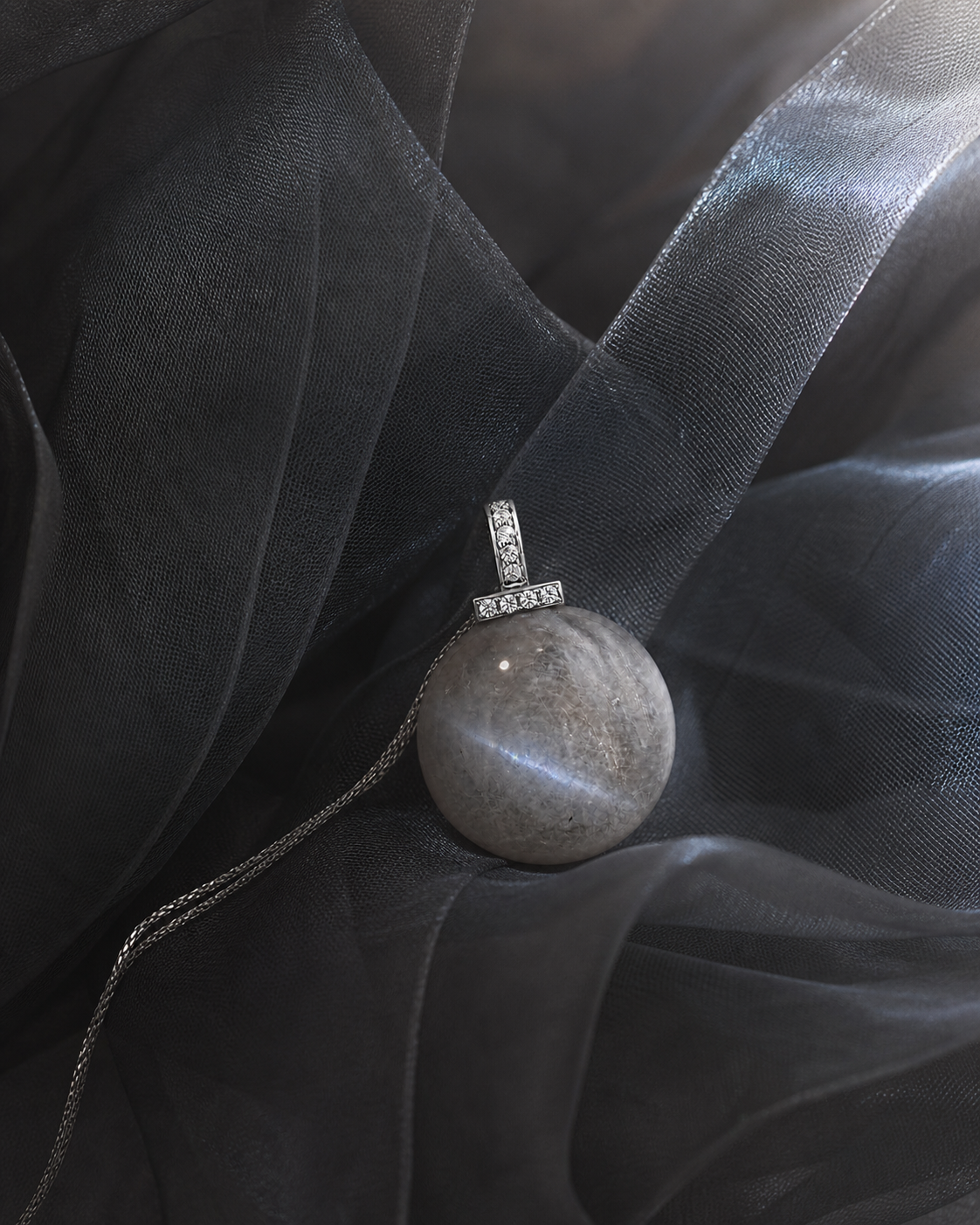 Gray Moonstone interchangeable pendant necklace, crystal still-life detail