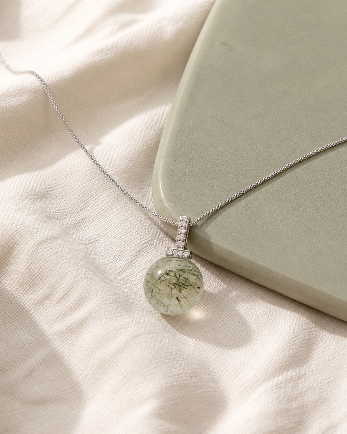 Green Rabbit Hair Quartz interchangeable pendant necklace, crystal still-life detail
